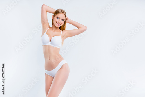 Portrait of nice attractive alluring adorable charming sweet skinny thin sportive cheerful girl enjoying lifestyle isolated over light gray background