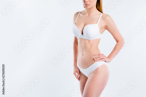 Cropped view of nice attractive adorable alluring fit thin sportive girl with healthy perfect figure medical clinic salon procedure isolated over light gray background
