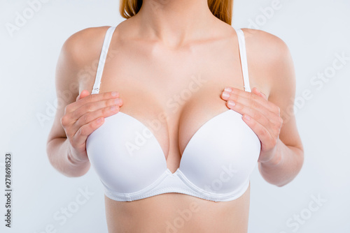 Cropped close-up photo of nice well-groomed girl touching perfect shape chest breast reduction cancer early diagnostic isolated over light gray background