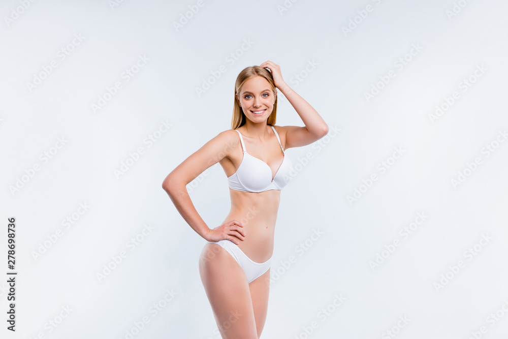 Portrait of nice cute attractive charming lovely sweet sportive perfect skinny cheerful positive blonde girl smooth clean clear shine healthy soft skin isolated over light gray background