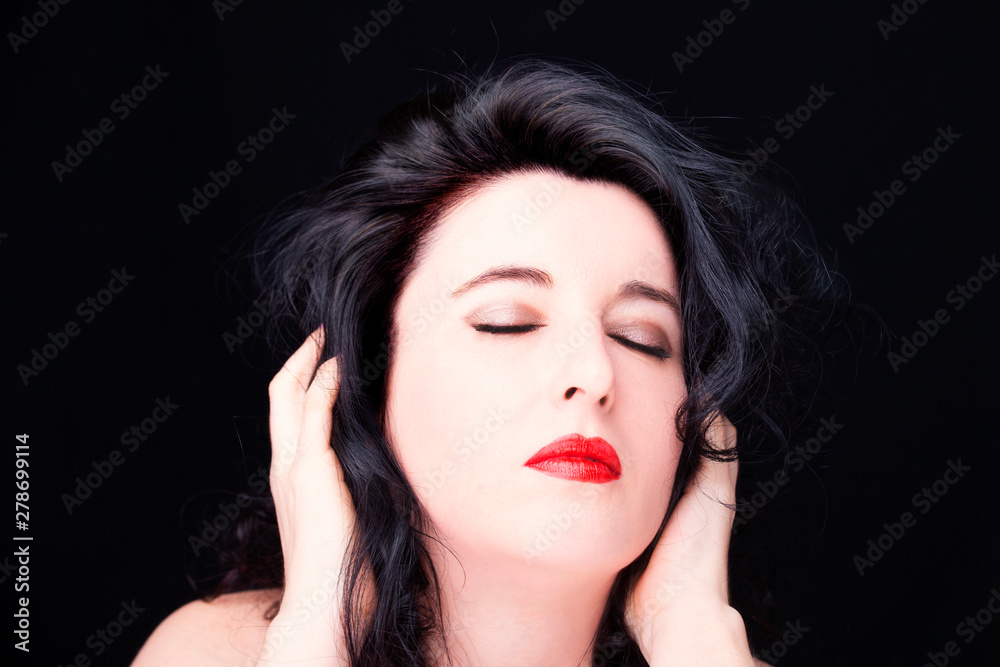 Portrait of a young attractive woman on dark background Portrait of a young attractive woman on dark background