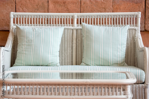 White rattan couch and tea table