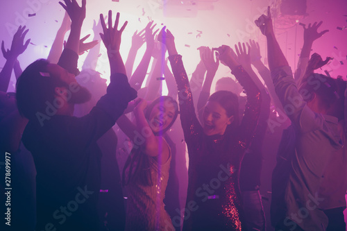 Photo of many birthday amazing people dancing students life purple lights confetti flying nightclub hands raised shiny formal-wear