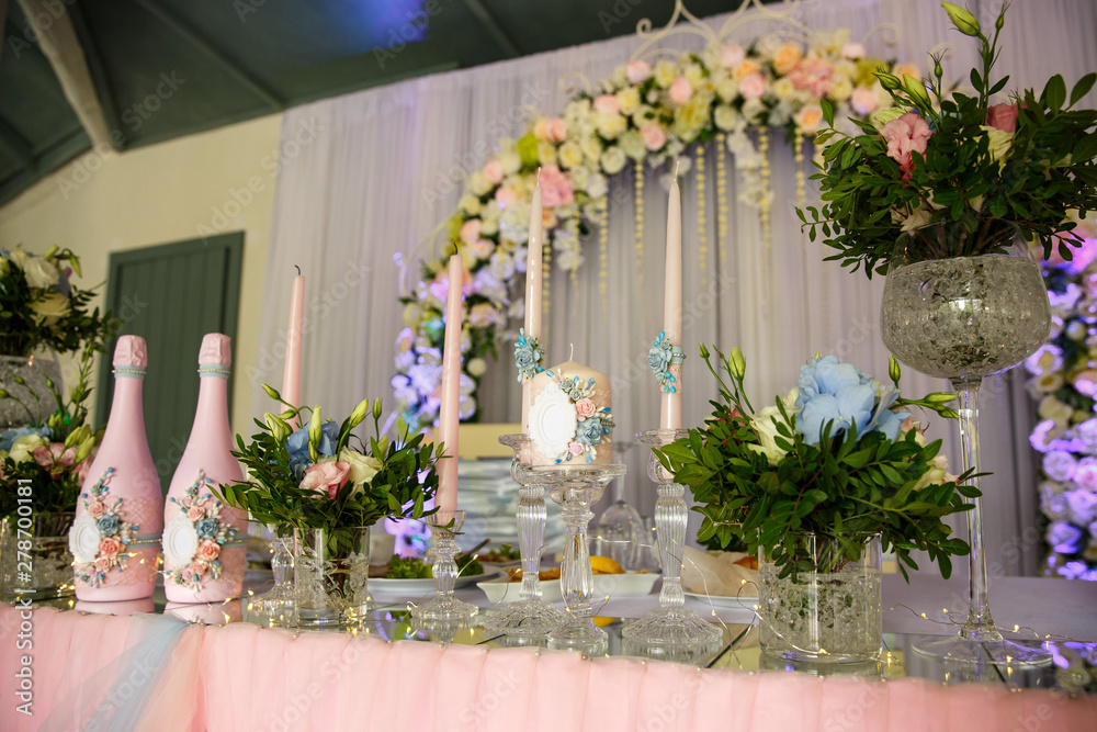 Wedding. Banquet. Table served with cutlery, flowers and crockery and covered with a tablecloth. Wedding decoration Wedding. Banquet. Table served with cutlery, flowers and crockery and covered with a tablecloth. Wedding decoration