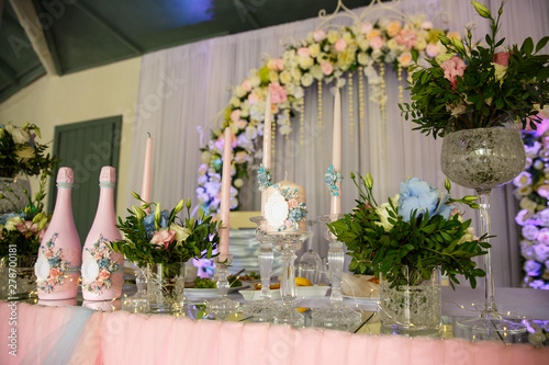 Wedding. Banquet. Table served with cutlery  flowers and crockery and covered with a tablecloth. Wedding decoration