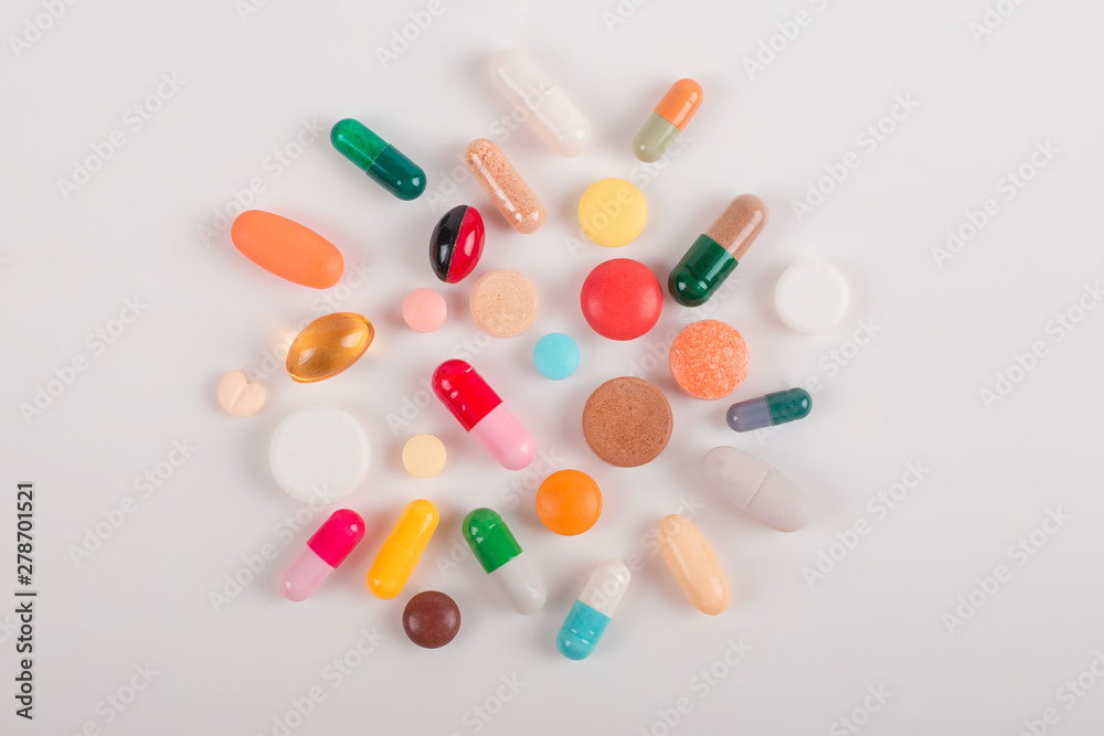 High number of pills on white background surface. High resolution image for pharmaceutical industry. High number of pills on white background surface. High resolution image for pharmaceutical industry.