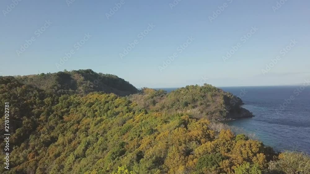 Green highlands and lake on sea shore landscape from flying drone. Aerial view green lake on hilly island and blue sea landscape on sky background. Green highlands and lake on sea shore landscape from flying drone. Aerial view green lake on hilly island and blue sea landscape on sky background.