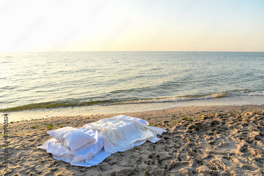 Bed with bed linen on the beach Bed with bed linen on the beach