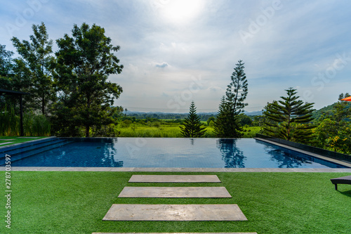 the pool front view home in the nature with outdoor nature