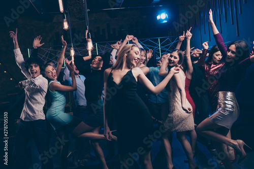 Nice-looking gorgeous attractive glamorous elegant cheerful glad positive stylish girl and guys having fun free time festive feast in modern fashionable luxury place night-club indoors
