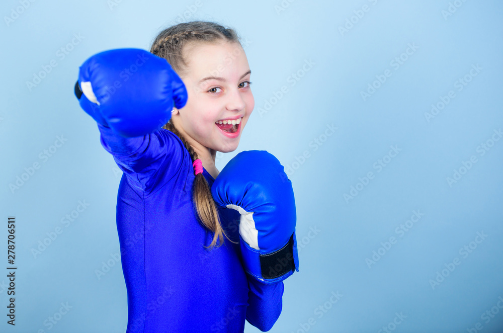 Feminism concept. With great power comes great responsibility. Boxer child  in boxing gloves. Girl cute boxer on blue background. Rise of women boxers.  Female boxer change attitudes within sport Stock-Foto | Adobe