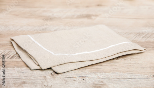  Beige tablecloth on a wooden table