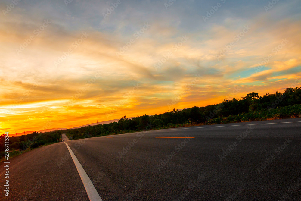 The road in the valley at the time of the sunset Concept of vacation and travel