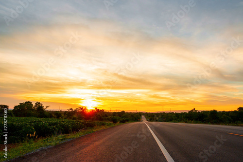 The road in the valley at the time of the sunset Concept of vacation and travel