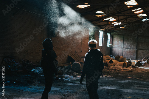 Two urban explorers in a old factory 
