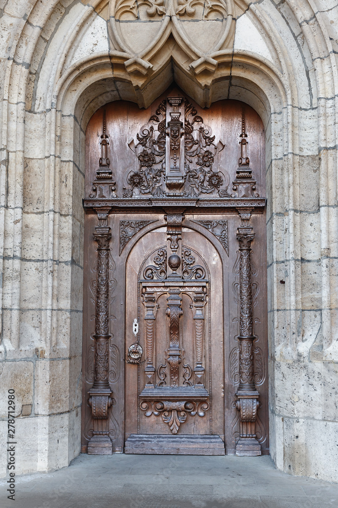 Old wooden door ornate wood carving in the historic part of the German town of Ulm