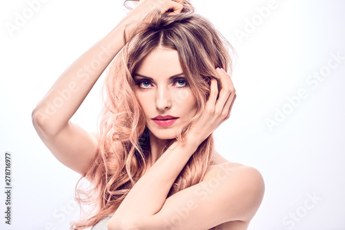 Beauty fashion portrait. Glamor sexy blonde girl with styling hair, fashionable makeup. Beautiful woman with perfect skin, trendy wavy hairstyle. Skincare facial treatment make up concept