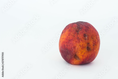 An ugly nectarine isolated close up copy space