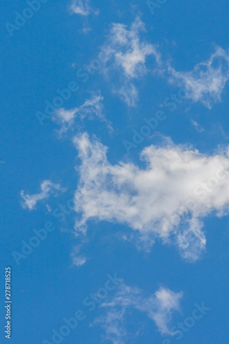 white cumulus clouds on blue sky natural background