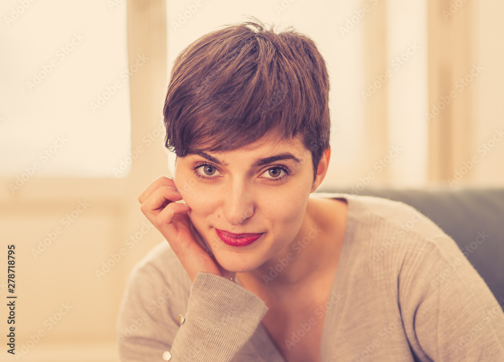 Beautiful lifestyle portrait of young woman happy and relaxed at home Beautiful lifestyle portrait of young woman happy and relaxed at home