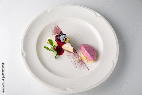 Dessert. Delicious cheesecake with berries. Banquet festive dishes. Fine dining restaurant menu. White background. 