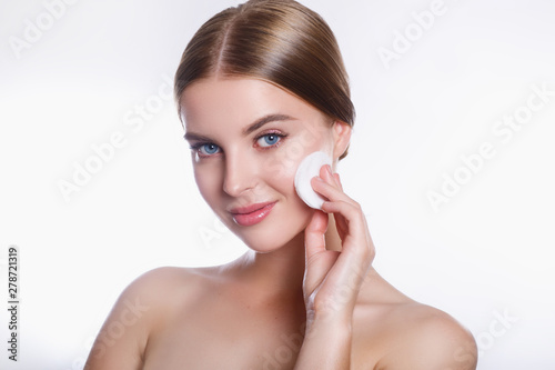 Beautiful young smiling woman with clean cotton pads . Beauty skin care famale face
