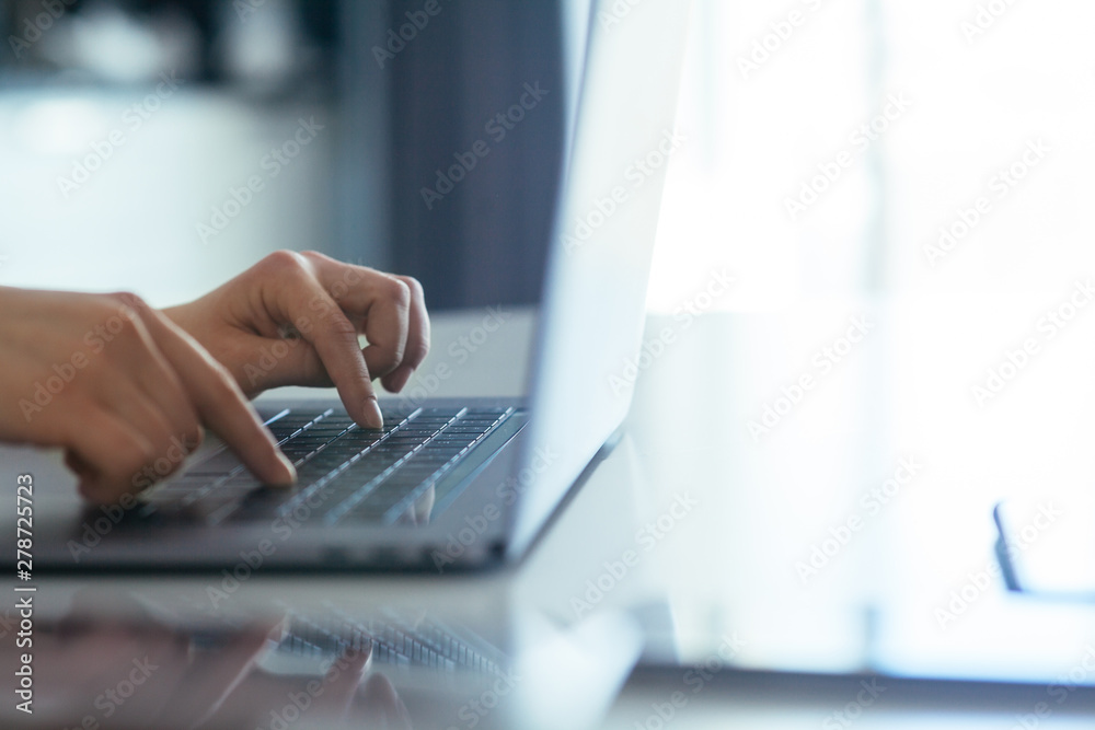 .Hands of a girl working on a laptop. .Hands of a girl working on a laptop.