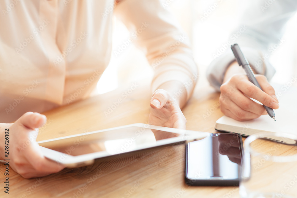 Hipster girl touching with finger on mock up display of modern touch pad connected to free 4G internet connection.Cropped view of woman's hands holding digital tablet with blank screen for website Hipster girl touching with finger on mock up display of modern touch pad connected to free 4G internet connection.Cropped view of woman's hands holding digital tablet with blank screen for website
