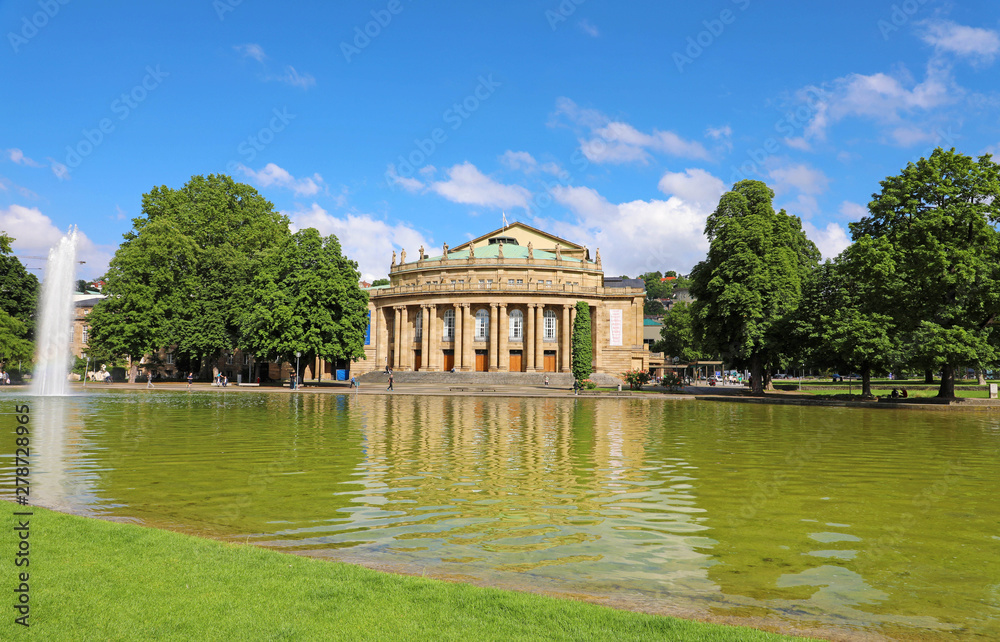 Stuttgart theatre building and fountain in Eckensee lake, Germany
