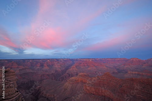 Pink clouds over the south rim of the Grand Canyon at sunset from Mather Point in Grand Canyon National Park, Arizona.