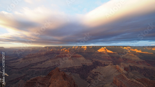 View of the Grand Canyon under a complex cloudscape from the South Rim Trail in Grand Canyon National Park, Arizona, in winter.