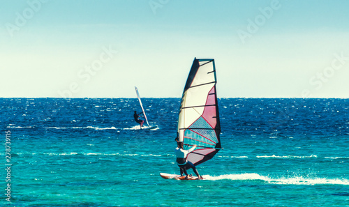 young surfer girl rides a sail in the Red Sea in Egypt Dahab © Sofiia