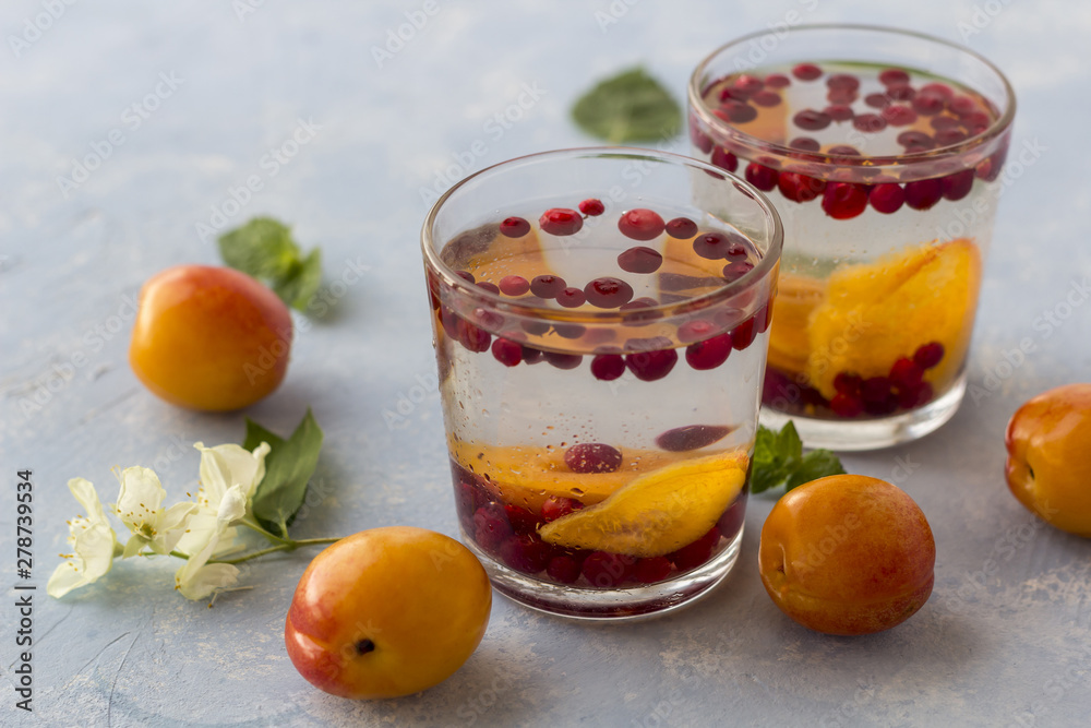 Fresh cool detox drink with berries and peaches or aprikotes. Fresh cool detox drink with berries and peaches or aprikotes.