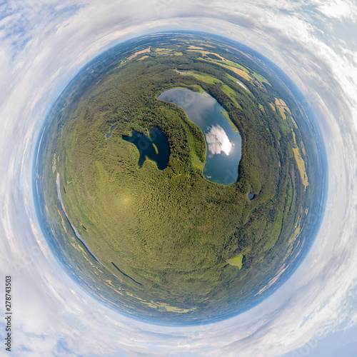 Fototapeta Naklejka Na Ścianę i Meble -  The Lakes in the forest. National park in Belarus. Drone aerial little planet panorama