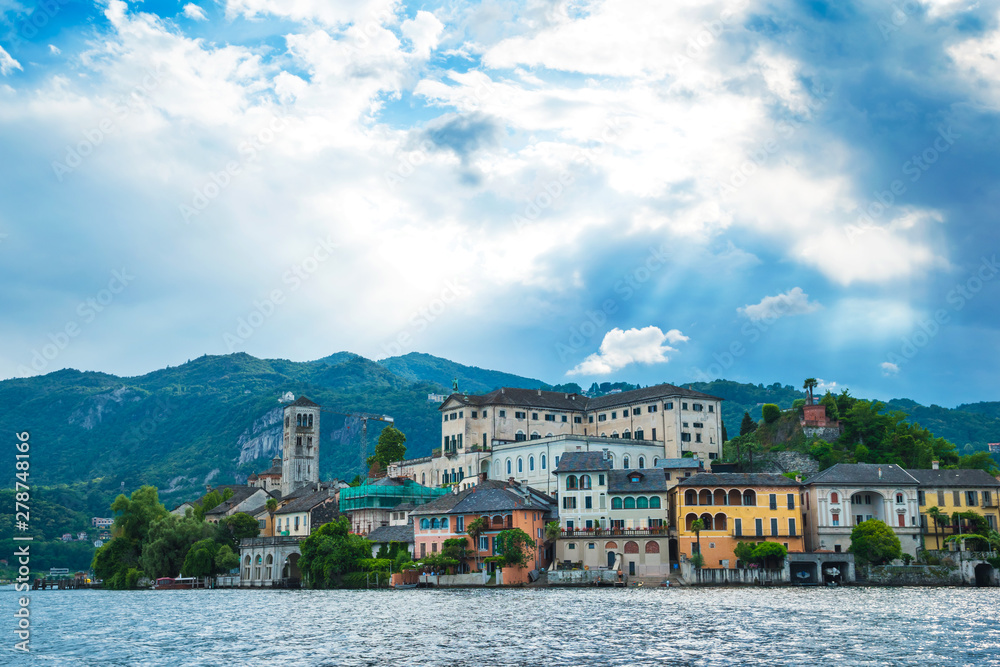Scenery view to Isola San Giulio island in sunlight. 