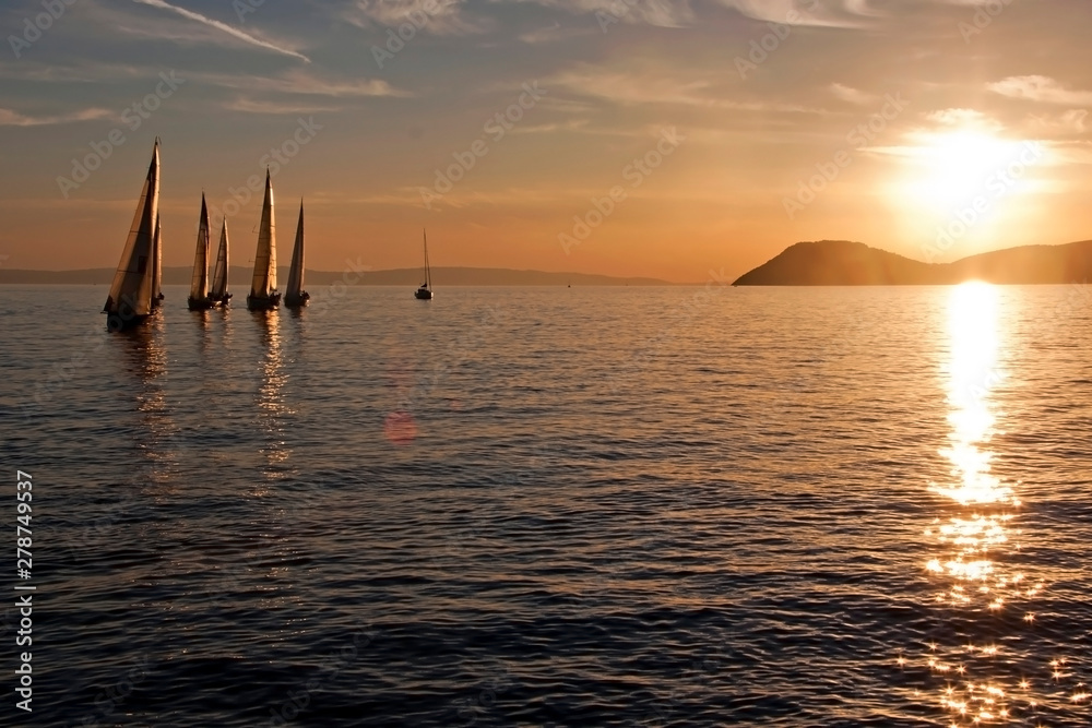 Sailboats in sunset