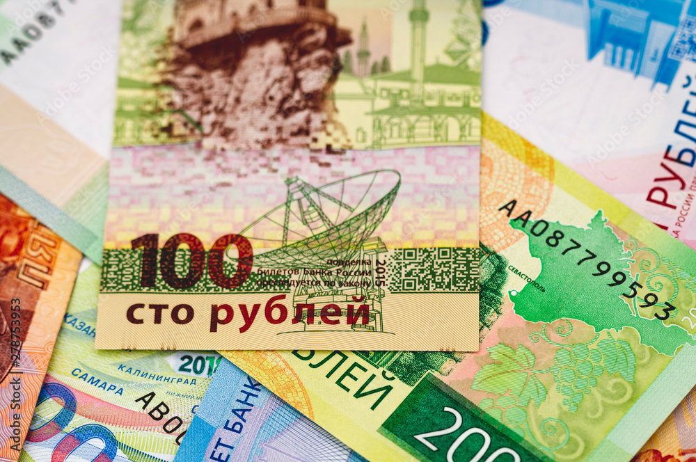 one hundred Russian rubles close-up against the background of cash