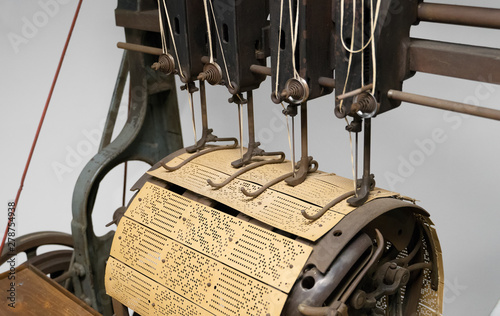Binding machine. Used to sew together perforated cards for the Jacquard loom.