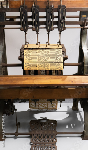 Binding machine. Used to sew together perforated cards for the Jacquard loom.