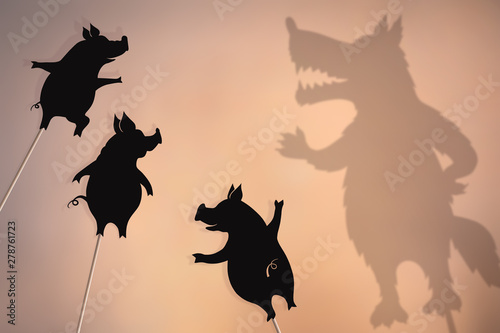 Three little pigs storytelling, shadow puppets. photo