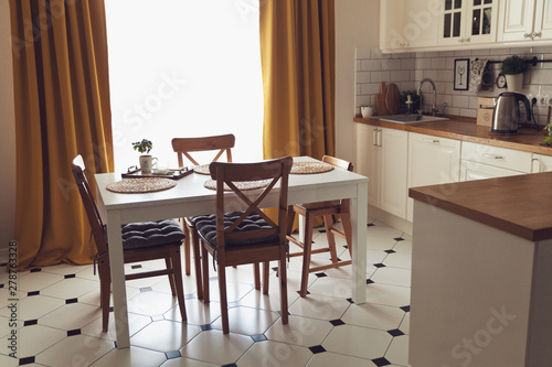 Modern Scandinavian style kitchen with dining table