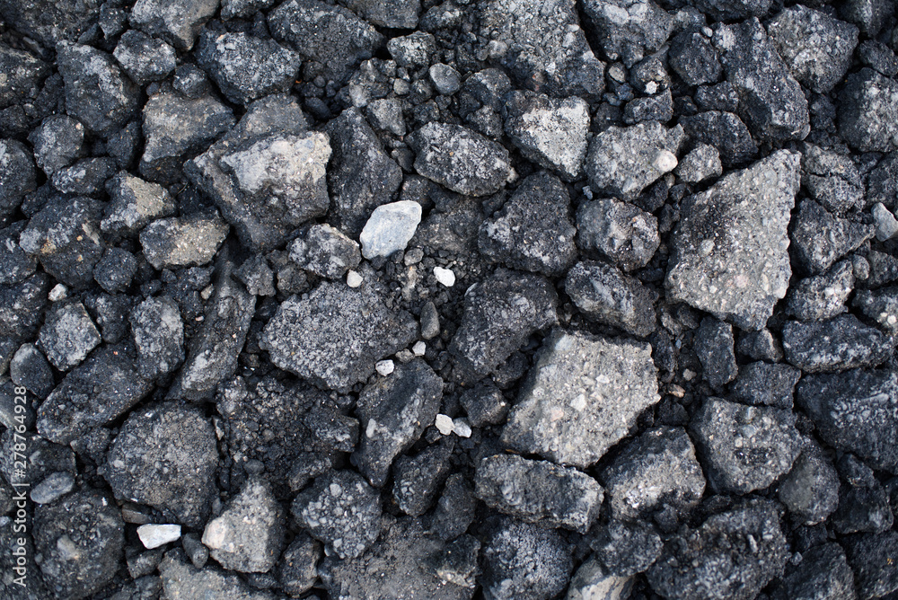 Pieces of asphalt pavement in the hole in the road Pieces of asphalt pavement in the hole in the road