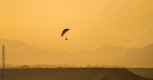 silhouette of a kite in the sunset