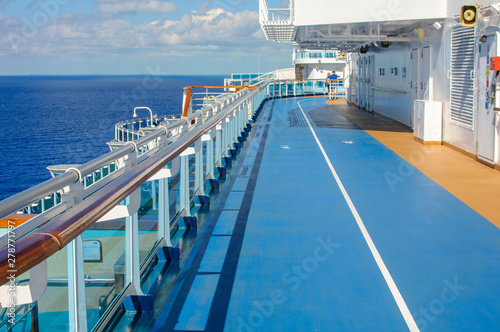 Blue treadmill along the deck of a cruise ship for Jogging while sailing.