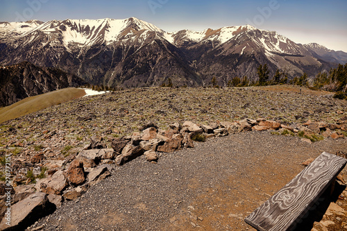 a bench with a view at the top of the world