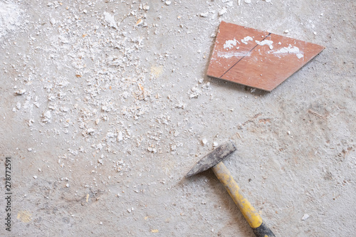 sawdust and hammer on concrete floor