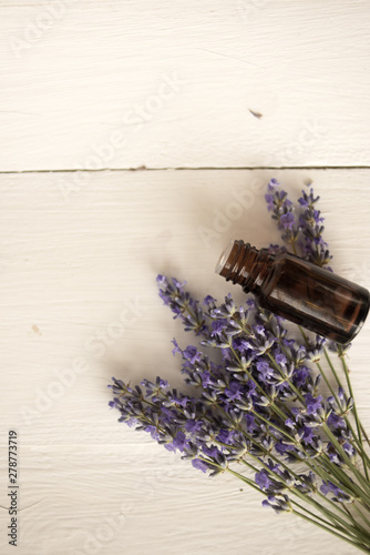 fragrant jar of lavender oil and a delicate bouquet of wild flowers.