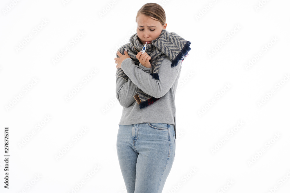 Young sick woman wrapped in a scarf on white background. Cold, flu, illness. Young sick woman wrapped in a scarf on white background. Cold, flu, illness.
