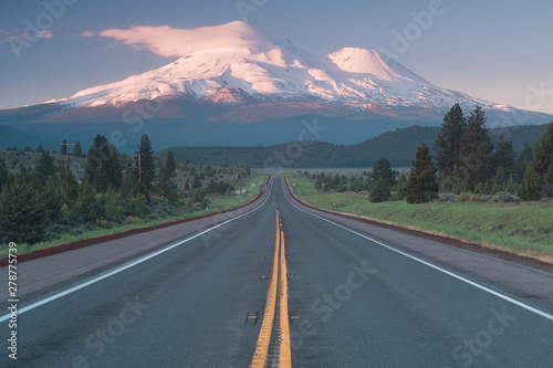 Road towards Mounts Shasta and Shastina in California, United States Highway 97 in Northern California heading South toward a mountain called Shasta volcano, USA