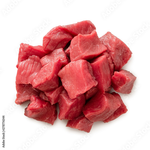Fotografie Pile of beef cubes isolated on white from above.